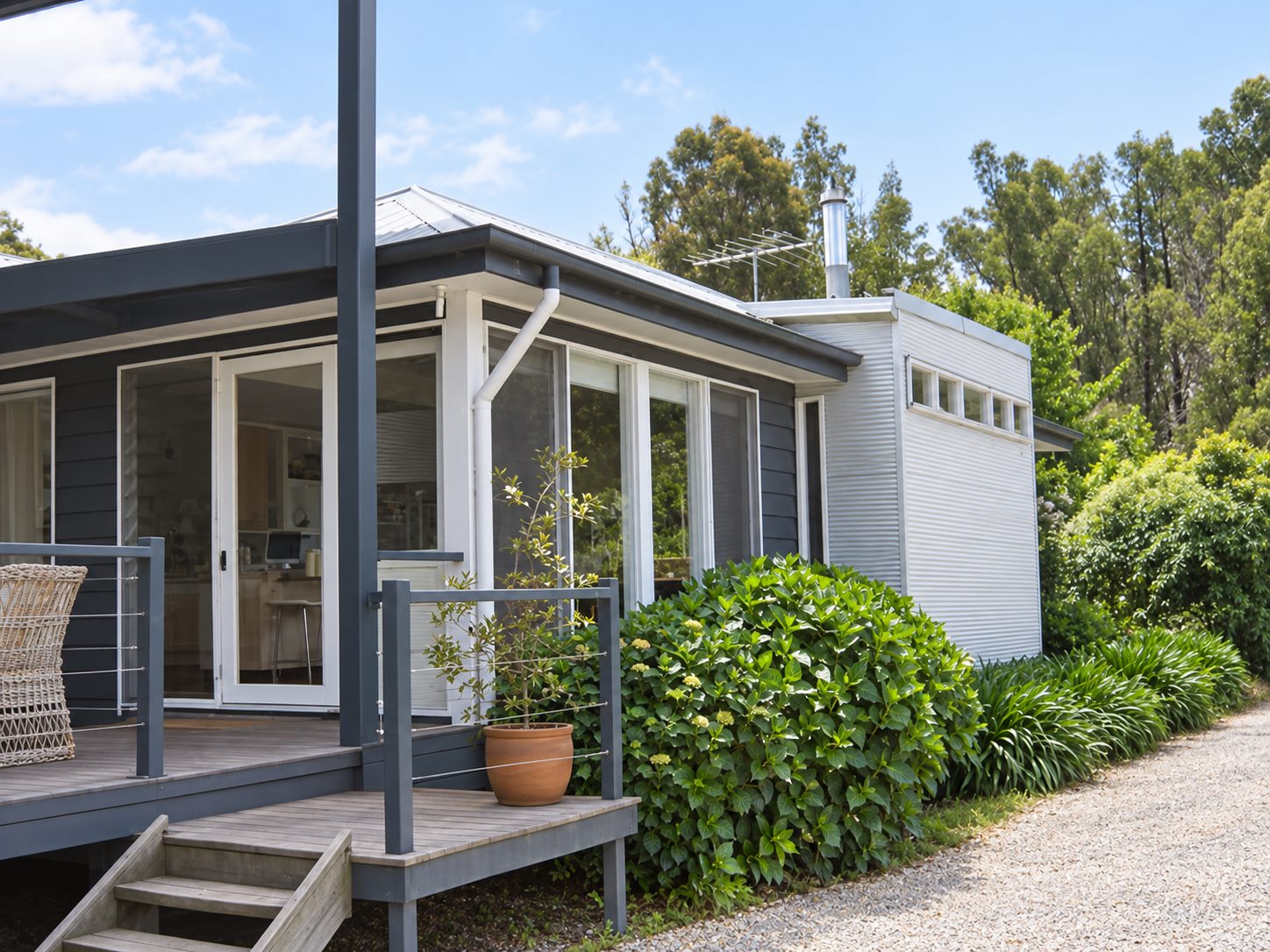 The deck along the garden side, sliding doors back into the kitchen
